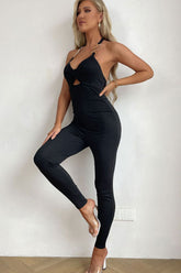 Combinaison moulante à découpes torsadées sur le devant et col licou